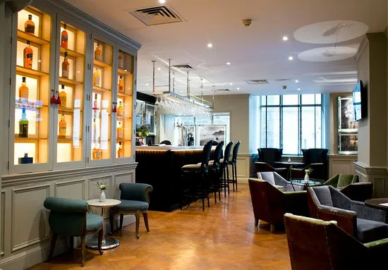 Serving whisky and Scotsman dishes