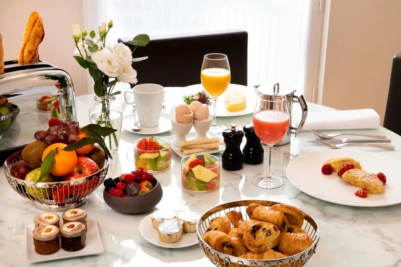 Serving typical Parisian breakfasts