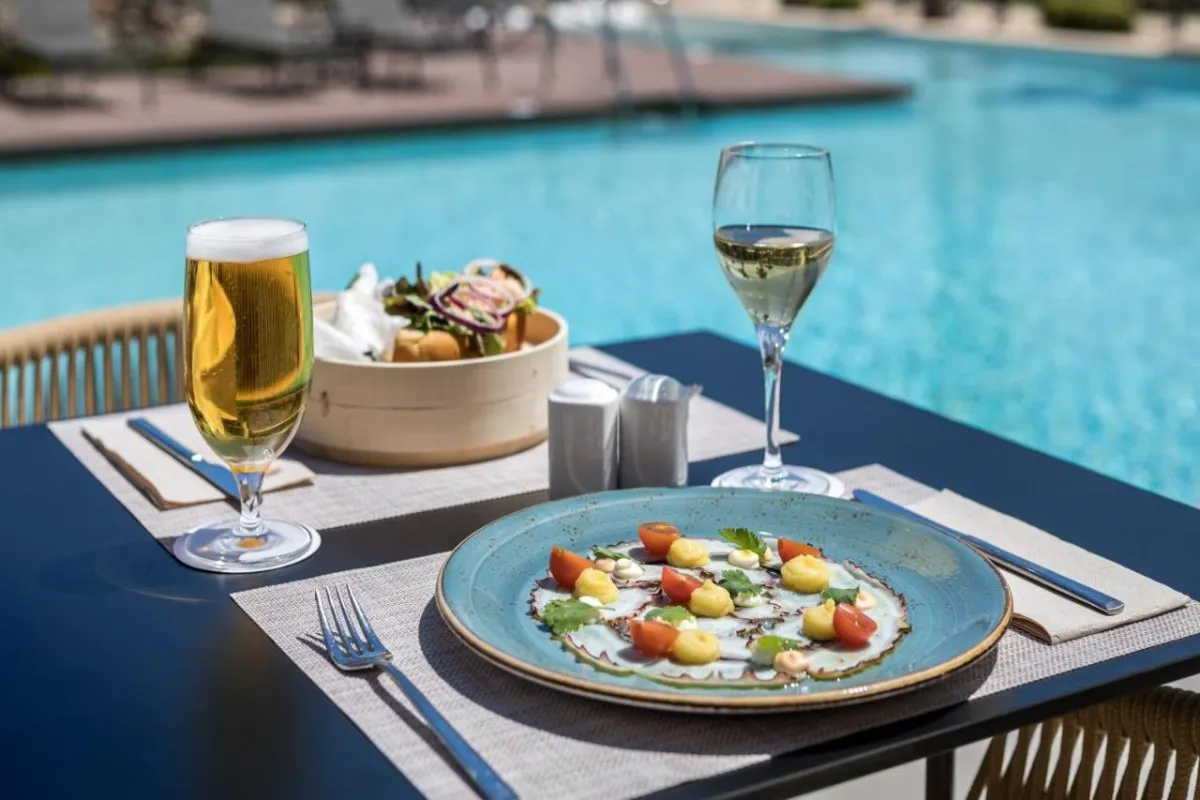 Tuck into poolside snacks and tapas