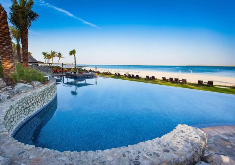 Relax in the palm tree lined pools