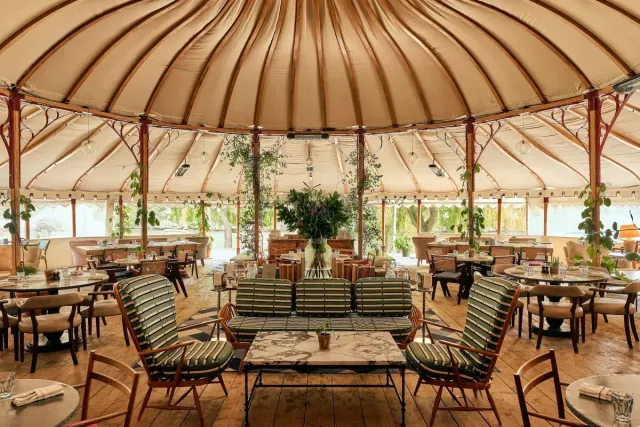 Wine   dine next to the river in summer