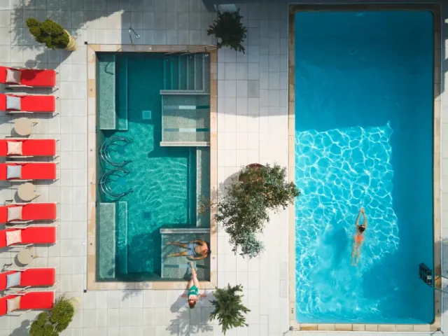 Take a dip in the outdoor swimming pool