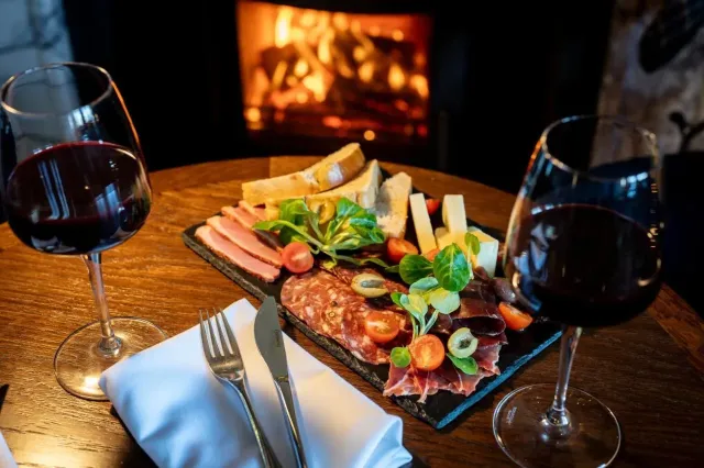 Relax by the fire with a whisky or glass of wine