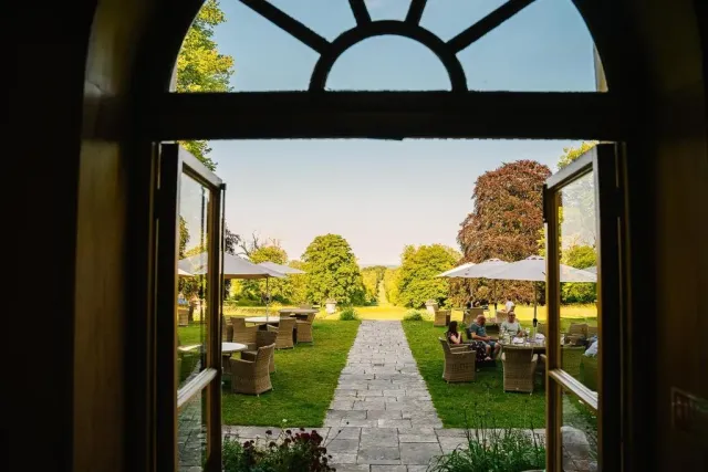 Unwind with a drink overlooking the gardens
