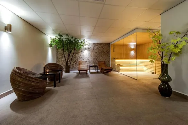 A sauna and steam room await