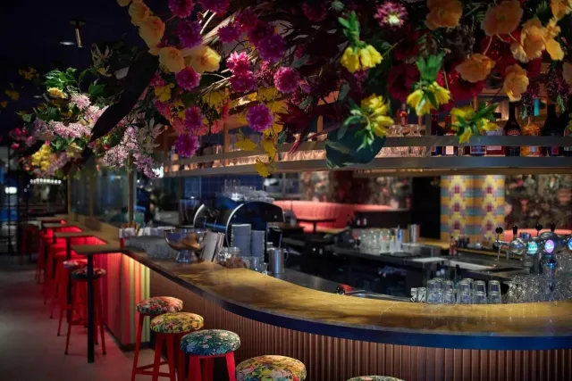 With a fully stocked bar serving cocktails